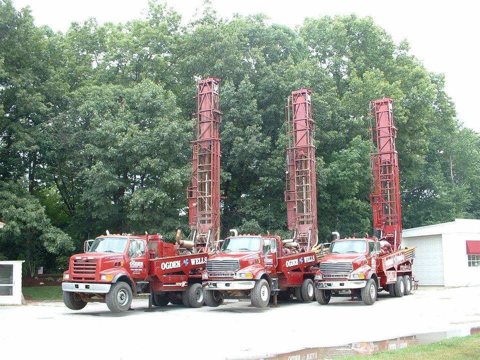 T.J. Ogden Co. heavy rotary drilling rigs deployed with masts raised in New England